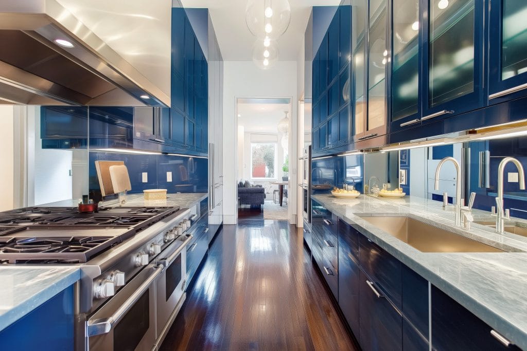 modern design kitchen with mirror backsplash